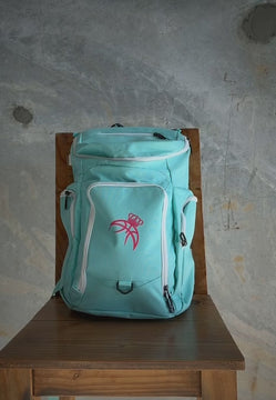 Packing the aqua Courtside Backpack with a jersey, shoes and a basketball